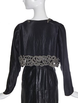Lot 462 - A Norman Hartnell black ciré satin evening gown, circa 1930