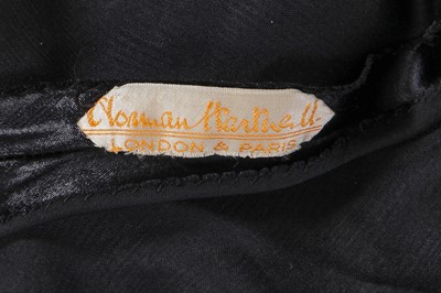 Lot 462 - A Norman Hartnell black ciré satin evening gown, circa 1930