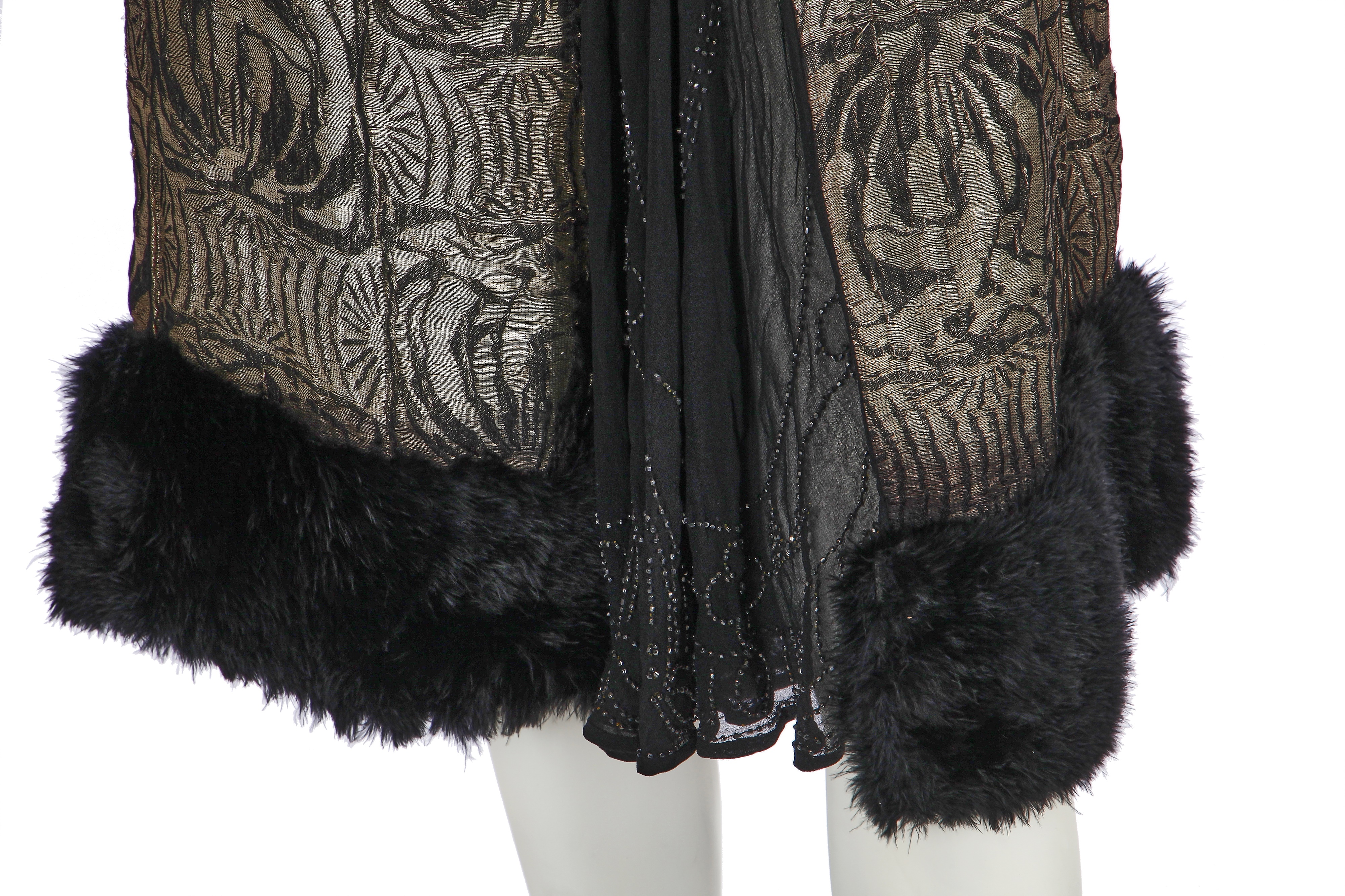 Lot 371 - A black and silver lamé flapper dress, circa
