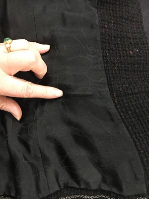 Lot 16 - A Chanel black bouclé jacket, 1990s