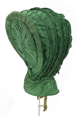 Lot 488 - A green silk caleche bonnet, early 19th...