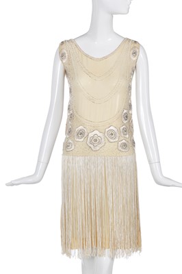 Lot 484 - A beaded and fringed ivory chiffon flapper dress, circa 1926