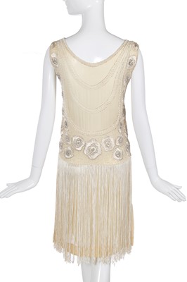 Lot 484 - A beaded and fringed ivory chiffon flapper dress, circa 1926