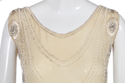 Lot 484 - A beaded and fringed ivory chiffon flapper dress, circa 1926