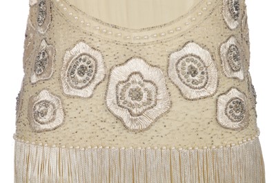 Lot 484 - A beaded and fringed ivory chiffon flapper dress, circa 1926
