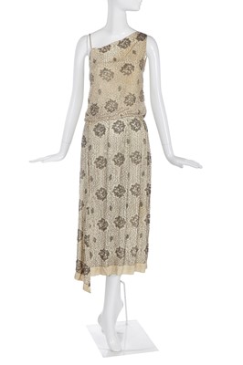 Lot 486 - A silver beaded ivory chiffon flapper dress, circa 1922