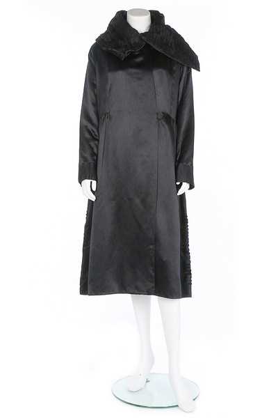 Lot 182 - A Paquin black satin coat, 1919, large woven...