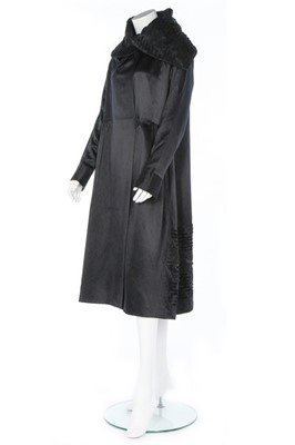 Lot 182 - A Paquin black satin coat, 1919, large woven...