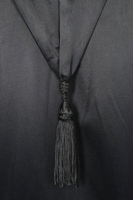 Lot 182 - A Paquin black satin coat, 1919, large woven...