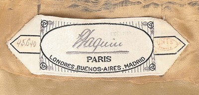 Lot 182 - A Paquin black satin coat, 1919, large woven...