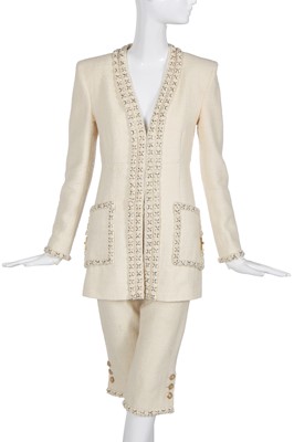 Lot 13 - A Chanel ivory bouclé wool suit, possibly 'Paris-Cosmopolite' collection, Métiers d'Art, Pre-Fall 2017