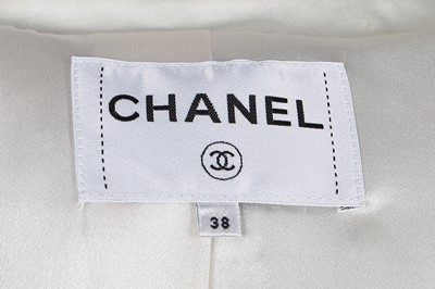 Lot 34 - A Chanel white and black tweed coat, Autumn-Winter 2017-18