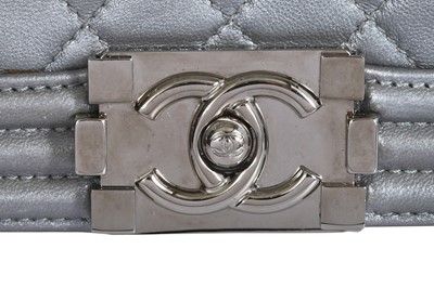 Lot 43 - A Chanel small silver Boy bag with flower strap,  'Paris-Bombay' collection, Métiers d'Art, Pre-Fall 2012