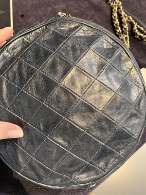 Lot 49 - A Chanel navy quilted leather circular bag, late 1980s