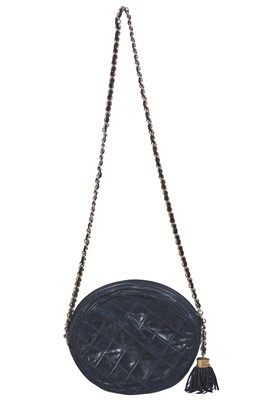 Lot 49 - A Chanel navy quilted leather circular bag, late 1980s