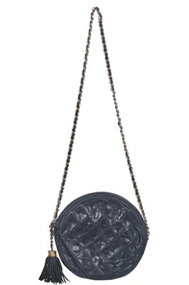 Lot 49 - A Chanel navy quilted leather circular bag, late 1980s