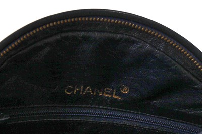 Lot 49 - A Chanel navy quilted leather circular bag, late 1980s