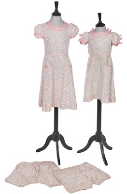 Lot 497 - A pair of matching printed cotton dresses, worn by Princess Elizabeth and Princess Margaret, circa 1936