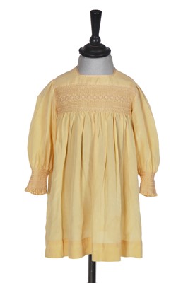 Lot 495 - A Smith & Co. primrose silk smocked dress, worn by Princess Elizabeth, circa 1930