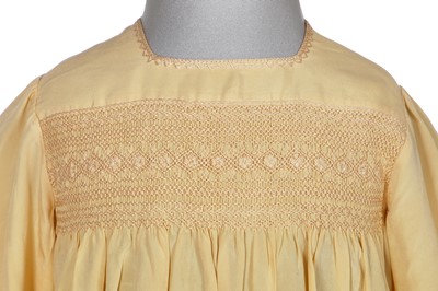 Lot 495 - A Smith & Co. primrose silk smocked dress, worn by Princess Elizabeth, circa 1930