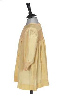 Lot 495 - A Smith & Co. primrose silk smocked dress, worn by Princess Elizabeth, circa 1930