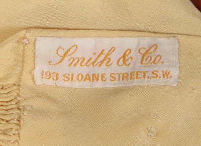 Lot 495 - A Smith & Co. primrose silk smocked dress, worn by Princess Elizabeth, circa 1930