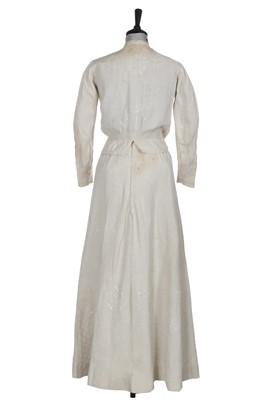 Lot 503 - A rare Redfern ivory linen summer sporting suit, circa 1905