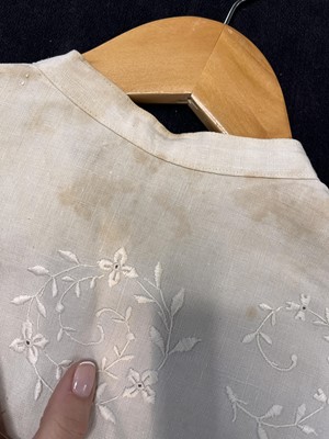 Lot 503 - A rare Redfern ivory linen summer sporting suit, circa 1905