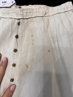 Lot 503 - A rare Redfern ivory linen summer sporting suit, circa 1905