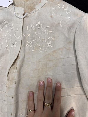 Lot 503 - A rare Redfern ivory linen summer sporting suit, circa 1905