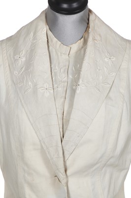 Lot 503 - A rare Redfern ivory linen summer sporting suit, circa 1905