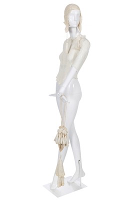 Lot 177 - A Vivienne Westwood tasselled ivory knitted ensemble, 'Cafe Society' collection, Spring-Summer 1994