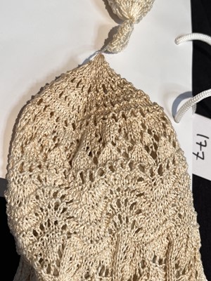 Lot 177 - A Vivienne Westwood tasselled ivory knitted ensemble, 'Cafe Society' collection, Spring-Summer 1994
