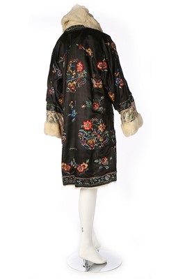 Lot 516 - A white rabbit fur lined and edged embroidered...