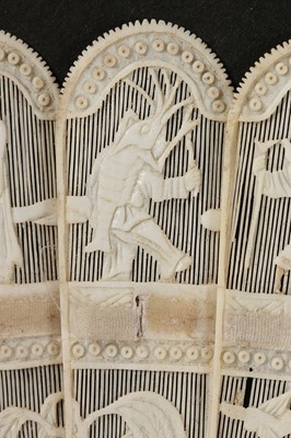 Lot 517 - A carved ivory brise fan, Chinese, circa...