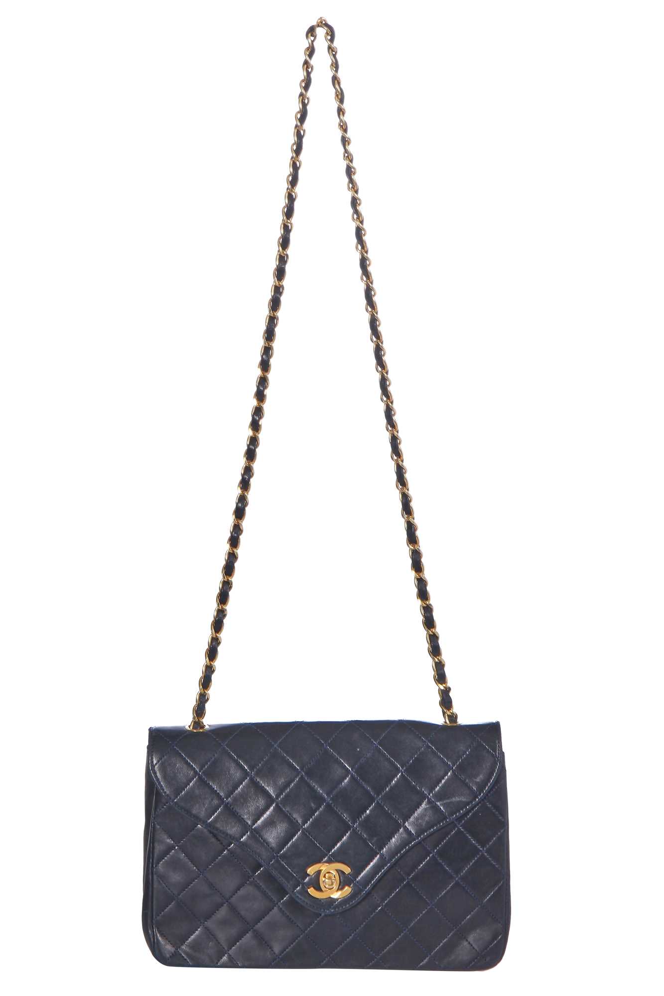 Lot 60 - A Chanel navy leather quilted flap bag, circa 1991