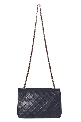 Lot 60 - A Chanel navy leather quilted flap bag, circa 1991