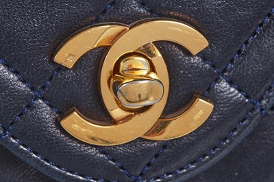 Lot 60 - A Chanel navy leather quilted flap bag, circa 1991