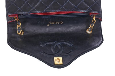 Lot 60 - A Chanel navy leather quilted flap bag, circa 1991