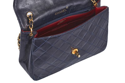 Lot 60 - A Chanel navy leather quilted flap bag, circa 1991