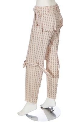 Lot 158 - A pair of Vivienne Westwood cream and red wool bondage trousers, 1990s-2000s
