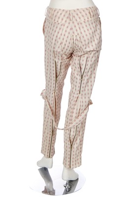 Lot 158 - A pair of Vivienne Westwood cream and red wool bondage trousers, 1990s-2000s