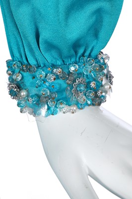 Lot 424 - A Loris Azzaro blue stretch jersey dress, 1970s