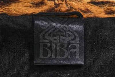 Lot 94 - A Biba black wool and faux cheetah 'dressing gown' jacket, circa 1973