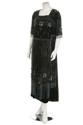 Lot 173 - A beaded tulle tabard, circa 1919, embellished...