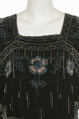 Lot 173 - A beaded tulle tabard, circa 1919, embellished...