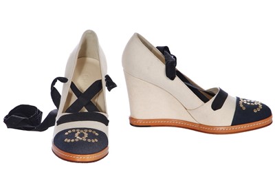 Lot 17 - A pair of Chanel ivory and black canvas wedges, 2010s