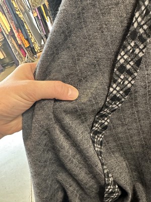 Lot 131 - A Biba black and grey checked polyester maxi coat, circa 1974