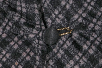 Lot 131 - A Biba black and grey checked polyester maxi coat, circa 1974