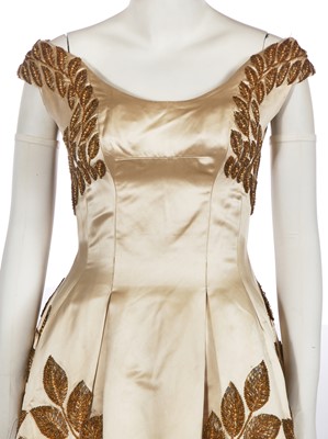 Lot 461 - A Norman Hartnell couture ivory satin evening gown, mid-1950s